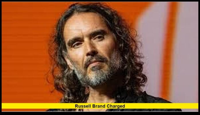 Russell Brand charged